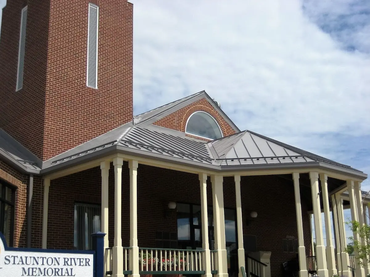 Skilled roofing craftsmen working on a residential roof in Burlington